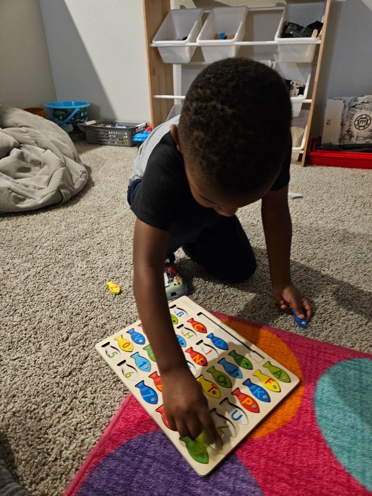 Boy with alphabet puzzle